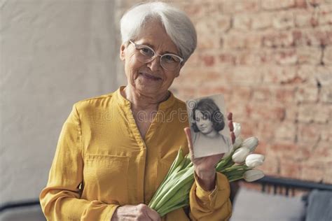 European Grey Haired Grandma Wearing Glasses And Showing Vertical Photo