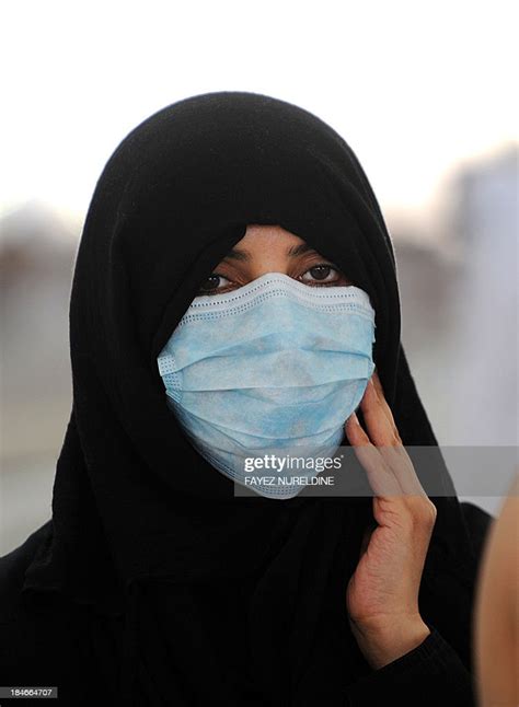 a muslim pilgrim wearing a mask due to fears of the deadly mers virus news photo getty images