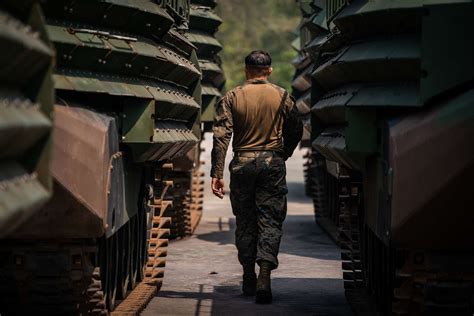 A Us Marine Walks Between Assault Amphibious Vehicles Nara And Dvids