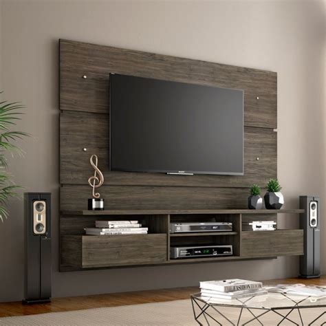 An Entertainment Center With A Flat Screen Tv And Speakers