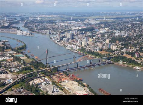 Aerial City View Of Pattullo And Skytrain Bridge Across The Fraser