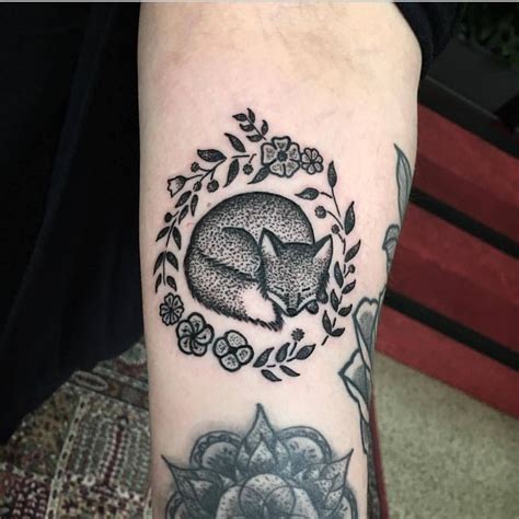 Check spelling or type a new query. Cute sleeping fox and flowers tattoo on the arm | Fox tattoo, Cute animal tattoos, Animal tattoo