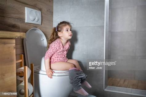 Girl Peeing On Toilet Photos And Premium High Res Pictures Getty Images