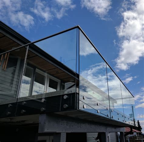 Rails must be able to support a load of at least 200 pounds and must extend at minimum 12 inches horizontally past the riser nosing at the top of the stairs and at least equal to one tread depth. Terrace railing Glass Steel Standoff Hardware Balustrade