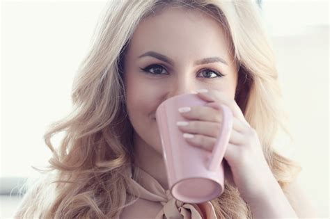Free Photo Candid Beautiful Blonde Woman Drinking Tea Or Coffee Cup