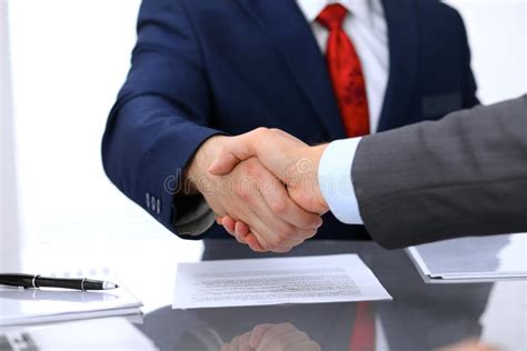 Two Business Man Shaking Hands To Each Other Above Signed Contract Stock Image Image Of Global