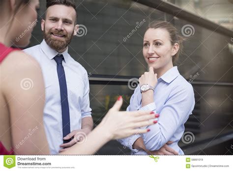 Three People Talking Outdoors Stock Image Image Of Formalwear