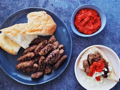 Download Traditional Cevapi Served With Warm Pita Bread Wallpaper