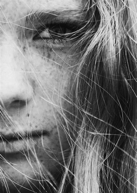 Black And White Close Up Shot Of Young Female Face With Freckles In
