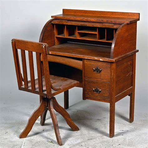 Lots of storage for little treasures is sure to build imaginations and make this fine piece of furniture an instant favorite as well as an heirloom. Wooden Child's Small Roll Top Desk w/ Chair