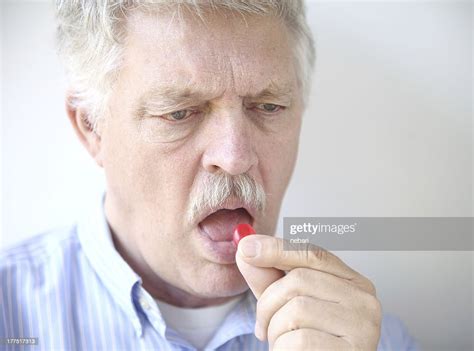 Senior Man With Cough Drop High Res Stock Photo Getty Images