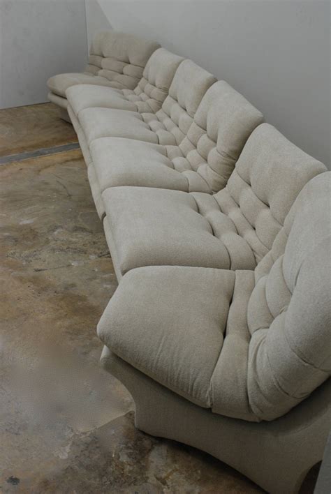 The sofa is artisan crafted with select materials to ensure lasting strength and impeccable good looks. Low Slung 1970s Style Sectional Sofa at 1stdibs