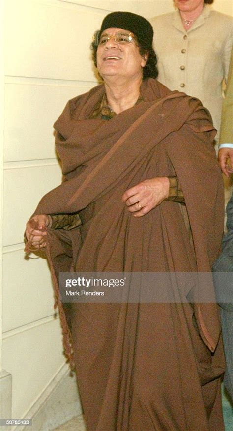 Libyan Leader Muammar Gadaffi Walks Round The Belgian Chamber On