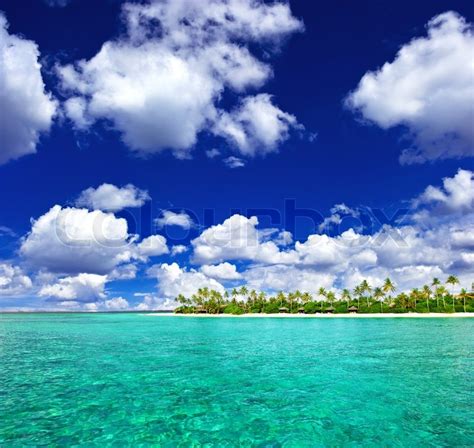Landscape Of Tropical Island Beach With Cloudy Sky Stock Photo