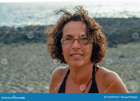Portrait Of Pretty Tanned Mature Woman With Glasses Stock Photo Image