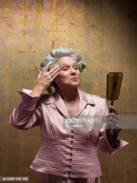 old woman hair rollers photos and premium high res pictures getty images