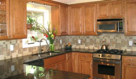 We kept the honey oak cabinets (hubby's decision, of course), and put in ubatuba granite, darkened the hardware, and took down a wall to make a peninsula between kit and dining. Uba Tuba Granite With Light Hioney Oak Cabinets : Pictures of $39 per sq ft for granite ...