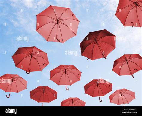 Red Umbrellas And Blue Sky Stock Photo Alamy