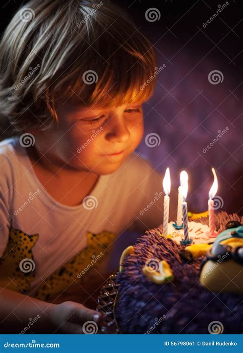 Little Boy Blows Out Candles On His Birthday Stock Image Image Of