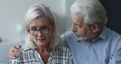 Older Frustrated Couple Talking Seated On Sofa At Home Stock Footage Video Of Adult Trouble