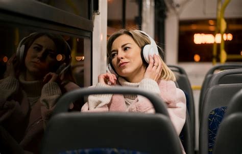 Free Photo Woman Wearing Headphones Sitting In Bus