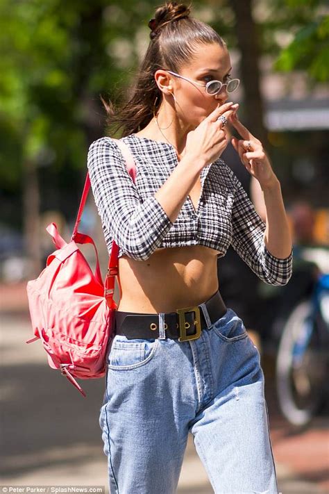 Bella Hadid Shows Off Major Underboob In A Plaid Crop Top While Running