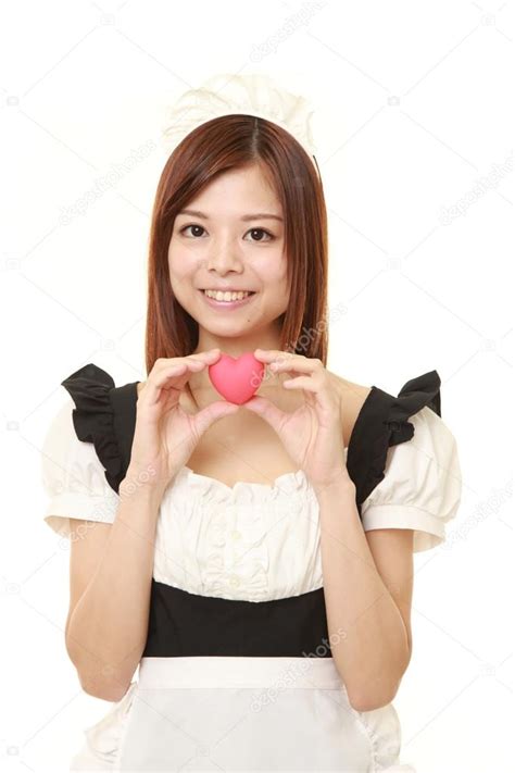 Young Japanese Woman Wearing French Maid Costume With Pink Heart Stock