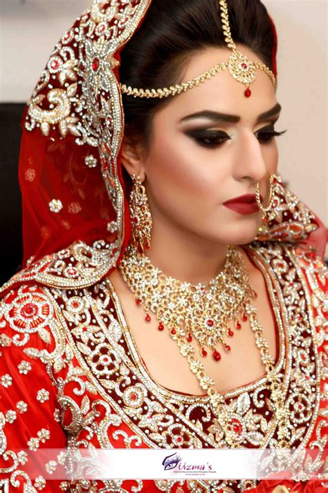 a beautiful asian british bride wearing matha patti and tikka