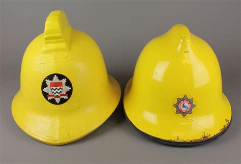 Lot 215 A Yellow London Fire Brigade Firemans Helmet And A Yellow