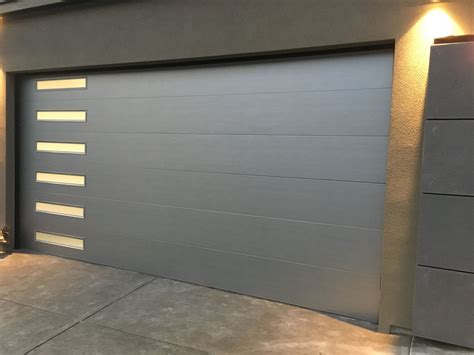 Why choose garage door tech services. Modern Tech brushed nickel anodized aluminum garage door ...