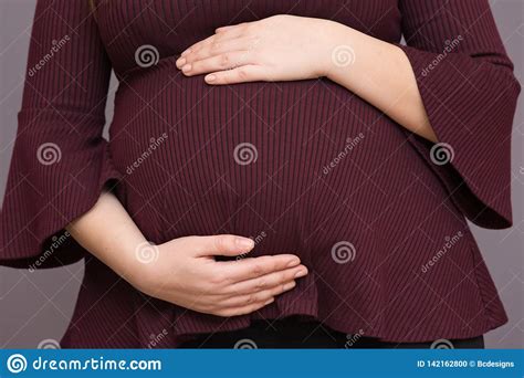 Expectant Mom Holding Her Budding Baby Bump Stock Photo Image Of