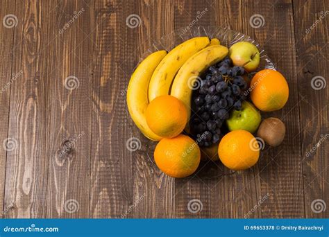Grapes Oranges Bananas Kiwi And Apples Are In Dish Stock Photo
