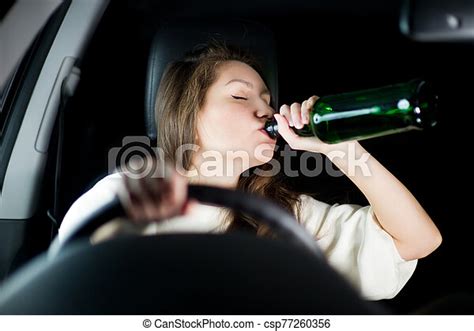 Girl Makes A Big Mistake Drinking Alcohol While Driving Young Woman Drives A Car At Night And