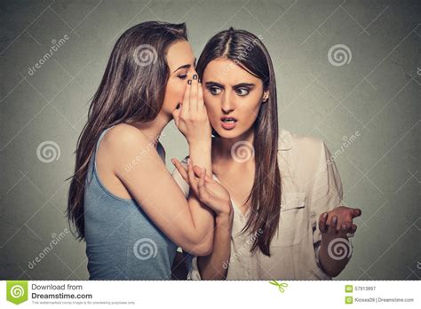 Girl Whispering Into Woman Ear Telling Her Shocking Secret Stock Image 57913897