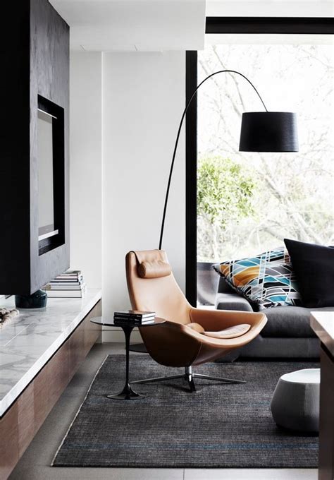 The arne jacobsen floor lamp is from design within reach, and the cocktail table was designed by the home's decorators, shelton, mindel & assoc. Floor lamps design ideas for your modern home interior