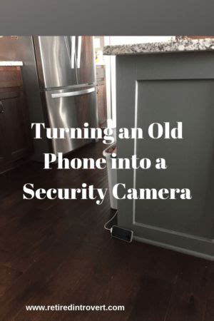 An Old Phone Into A Security Camera In A Kitchen With Dark Wood Floors