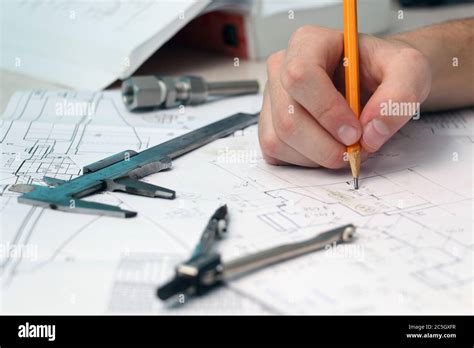 Sketching On The Mechanical Engineers Desktop Stock Photo Alamy