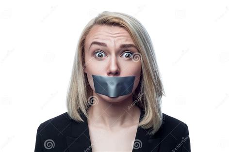 Blonde Girl With A Mouth Taped On A White Background Stock Photo