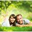 Happy Smiling Couple Together Relaxing On Green Grass Park You