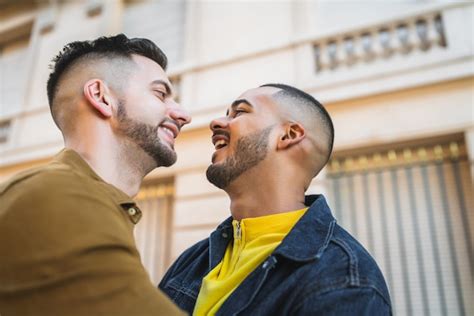 Free Photo Portrait Of Happy Gay Couple Spending Time Together And Hugging In The Street Lgbt