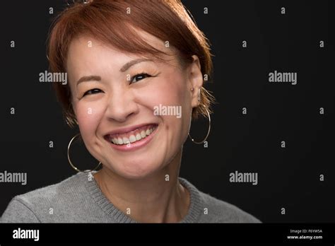 A Headshot Of A Smiling Middle Aged Japanese Woman Stock Photo Alamy