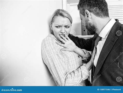 Boss Domination At Work Sexual Harassment Concept With Man And Woman In Office Stock Image