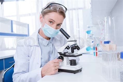 Scientist Working With Microscope Stock Image Colourbox