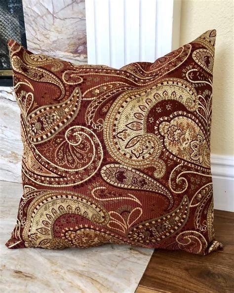 They provide more targeted support wherever you need it. Tips and selection for a Scandinavian style living room | Paisley throw pillows, Burgundy throw ...