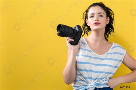 Young Woman With A Professional Camera Stock Photo Crushpixel