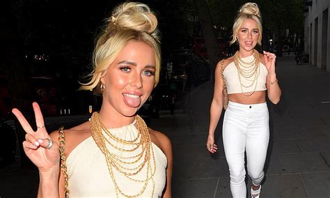 Gabby Allen Flashes Her Toned Abs In Cream Crop Top As She Heads For