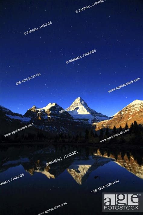 Stars And Mt Assiniboine Reflected In A Tarn In Moon Glow Mt