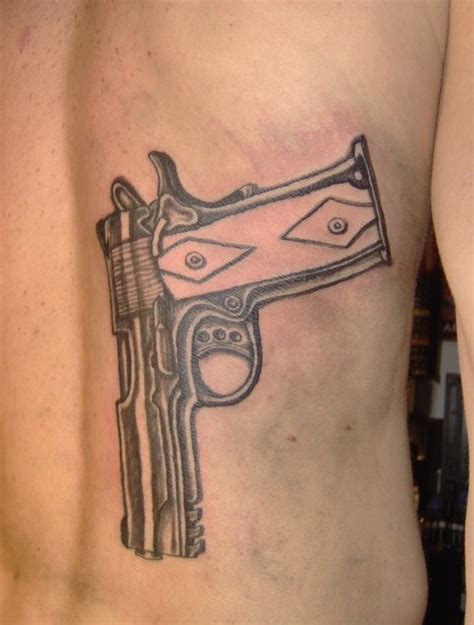 For those that have served in the military, guns gain a new and powerful meaning. Gun Tattoos - tattoos-and-art.com