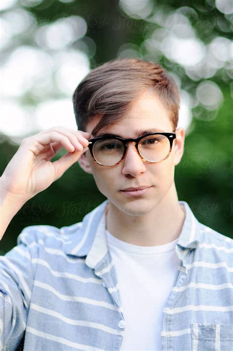 A Young Man Wearing Glasses Looking At The Camera By Chelsea Victoria