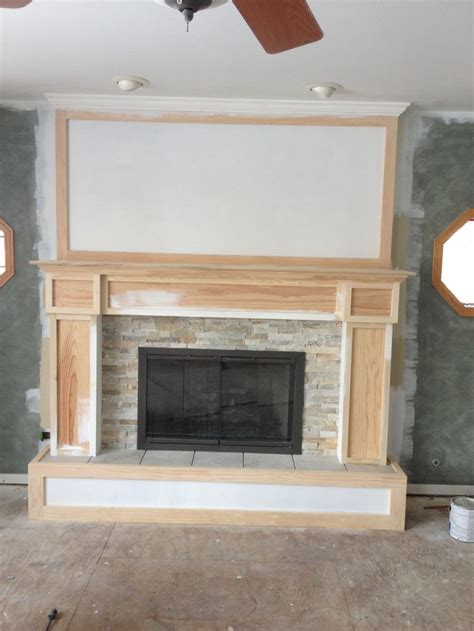 Set porcelain tiles onto mortar. Step 6: install fireplace surround. We used desert quartz ...